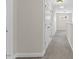 Bright hallway with neutral walls and plush carpeting leading to bedrooms and other living spaces at 166 Old Field Loop Loop, Sanford, NC 27332