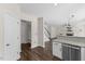Kitchen offers stainless appliances, granite counters, and open access to living areas and mud room at 166 Old Field Loop Loop, Sanford, NC 27332