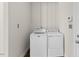 Bright laundry room features a modern washer and dryer at 166 Old Field Loop Loop, Sanford, NC 27332