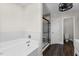 Elegant main bathroom with soaking tub, tiled shower, and contemporary design elements at 166 Old Field Loop Loop, Sanford, NC 27332