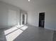 Spacious bedroom with multiple doors and neutral decor at 1681 Pecan Drive # 24, Nashville, NC 27856