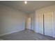 Simple bedroom featuring neutral walls, carpeted floor, and closet at 1681 Pecan Drive # 24, Nashville, NC 27856