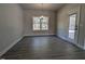 Bright dining area features a modern light fixture, a window and a door leading to the outside at 1681 Pecan Drive # 24, Nashville, NC 27856
