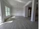 Dining room showcasing elegant trim work, large window, and contemporary chandelier at 1681 Pecan Drive # 24, Nashville, NC 27856