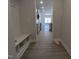 View of the entryway with a bench and storage, leading to an open kitchen at 1681 Pecan Drive # 24, Nashville, NC 27856