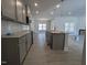 Kitchen boasts granite countertops, a central island, and sleek cabinetry at 1681 Pecan Drive # 24, Nashville, NC 27856