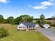 Beautiful aerial view of a well maintained home with a large lot, storage shed and shop building at 175 Bill Avery Rd, Coats, NC 27521