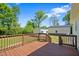 Wooden deck offers an inviting view of the backyard and surrounding outbuildings on the property at 175 Bill Avery Rd, Coats, NC 27521