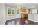 Eat-in-kitchen features wood floors, wood cabinets, and back door entrance at 175 Bill Avery Rd, Coats, NC 27521