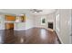 Open-concept living room with hardwood floors, fireplace, and a pass through to the kitchen at 175 Bill Avery Rd, Coats, NC 27521