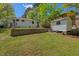 Wide view of home backyard with shed and retaining wall at 1804 N Alston Ave, Durham, NC 27701