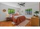 Bright bedroom with natural light, hardwood floors and ceiling fan at 1804 N Alston Ave, Durham, NC 27701