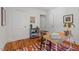 Bright bedroom featuring hardwood floors, a cozy desk nook, and neutral walls at 1804 N Alston Ave, Durham, NC 27701