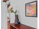 Stylish hallway decor with a unique vase, art, and a glimpse into another room with eye-catching design elements at 1804 N Alston Ave, Durham, NC 27701
