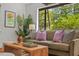 Bright and airy living room featuring modern decor, plush seating, and large windows providing natural light and scenic views at 1804 N Alston Ave, Durham, NC 27701
