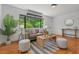 Cozy living room featuring hardwood floors, natural light, and a comfortable seating area perfect for relaxing or entertaining guests at 1804 N Alston Ave, Durham, NC 27701