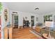 Inviting living room boasts hardwood floors, neutral paint, and an open floorplan offering seamless transitions to the kitchen and bathroom at 1804 N Alston Ave, Durham, NC 27701