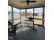 Cozy screened-in porch with a grill and seating, perfect for outdoor relaxation at 194 Wood Valley Dr, Four Oaks, NC 27524