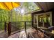 Inviting deck space with railing, seating and sliding door providing seamless indoor-outdoor living at 195 Nicks W Bnd, Pittsboro, NC 27312