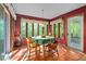Cozy dining room featuring a round table, ample natural light, and access to an outdoor area at 195 Nicks W Bnd, Pittsboro, NC 27312