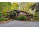 Exterior of home features a deck and surrounding natural beauty with ample parking at 195 Nicks W Bnd, Pittsboro, NC 27312