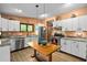 Well-lit kitchen featuring stainless steel appliances, ample counter space, and a functional layout at 195 Nicks W Bnd, Pittsboro, NC 27312
