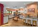 Spacious kitchen with white cabinets, wooden floors, stainless steel appliances, and granite countertops at 195 Nicks W Bnd, Pittsboro, NC 27312