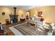 Cozy living room featuring a stone fireplace, hardwood floors, and comfortable seating area at 195 Nicks W Bnd, Pittsboro, NC 27312