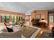 Spacious living room with large windows, comfortable seating, and a decorative rug at 195 Nicks W Bnd, Pittsboro, NC 27312