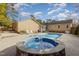 Backyard pool and hot tub combo with a stone surround, perfect for outdoor entertaining at 2009 Mallard Ln, Raleigh, NC 27609