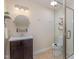 Bathroom featuring vanity with sink, toilet, and shower with glass door and shelving at 2009 Mallard Ln, Raleigh, NC 27609