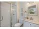 Bathroom featuring tile shower with glass doors, neutral walls, and tile floors at 2009 Mallard Ln, Raleigh, NC 27609