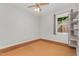 Simple bedroom with carpet flooring, a window, and minimalist metal shelving at 2009 Mallard Ln, Raleigh, NC 27609