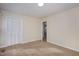 Bright bedroom featuring neutral walls, carpet, and a closet with bi-fold doors at 2009 Mallard Ln, Raleigh, NC 27609