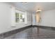 Large bonus room featuring tile flooring, a window with curtains, and neutral walls at 2009 Mallard Ln, Raleigh, NC 27609