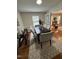 Dining room with seating for six, hardwood floors, and a view into the living room at 2009 Mallard Ln, Raleigh, NC 27609