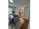 Charming dining room with seating for six, hardwood floors, and a view into the living room at 2009 Mallard Ln, Raleigh, NC 27609