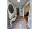 Inviting foyer featuring a stylish bench, decorative mirror, and attractive tile flooring at 2009 Mallard Ln, Raleigh, NC 27609