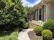 Charming front porch with steps leading to a beautifully landscaped yard and inviting home at 2009 Mallard Ln, Raleigh, NC 27609