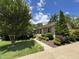 Charming home with well-kept front yard, complemented by mature trees and landscaping at 2009 Mallard Ln, Raleigh, NC 27609