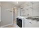Laundry room with shelving and modern washer and dryer at 2009 Mallard Ln, Raleigh, NC 27609