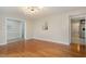 Open living room with hardwood floors and neutral wall color at 2009 Mallard Ln, Raleigh, NC 27609