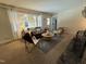 Bright living room with back patio view, comfy seating, and neutral colors at 2009 Mallard Ln, Raleigh, NC 27609