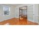Bright living room with hardwood floors, natural light, and french doors at 2009 Mallard Ln, Raleigh, NC 27609