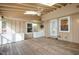 Enclosed sunroom featuring wood floors, skylights, and access to backyard at 2009 Mallard Ln, Raleigh, NC 27609