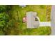 A high-angle shot shows a cozy home with a well-manicured yard and inviting backyard deck at 201 Lexington Park Dr, Oxford, NC 27565