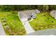 Beautiful aerial view of a home with a two-car garage, long driveway and extensive lawn at 201 Lexington Park Dr, Oxford, NC 27565