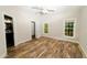 Bedroom featuring a doorway to a bathroom, closet, and two windows at 201 Lexington Park Dr, Oxford, NC 27565