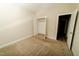 Empty bedroom with tan carpet and open closet at 201 Lexington Park Dr, Oxford, NC 27565