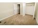 Carpeted bedroom with neutral walls and a closet with a white door at 201 Lexington Park Dr, Oxford, NC 27565